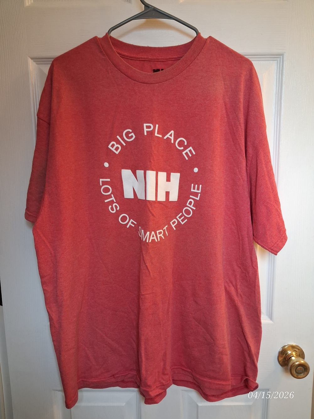 MV Sport Coral Red Short Sleeve Tee with White NIH Logo